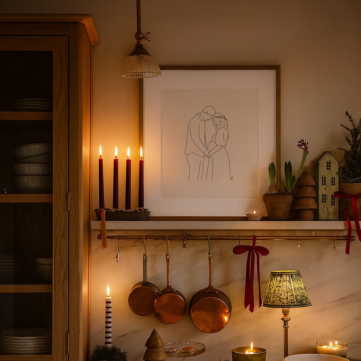 Candlelit kitchen with hanging pots, a framed artwork, and decorative items.